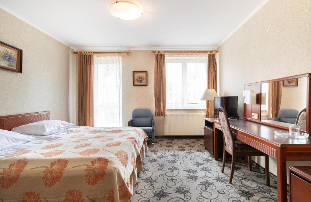 Postel nebo postele na pokoji v ubytování Ośrodek Wczasowy Marevita