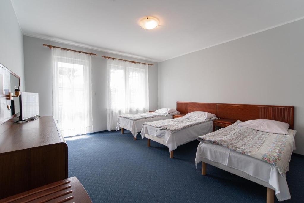 Postel nebo postele na pokoji v ubytování Ośrodek Wczasowy Marevita