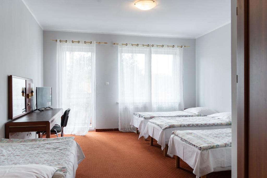 Postel nebo postele na pokoji v ubytování Ośrodek Wczasowy Marevita