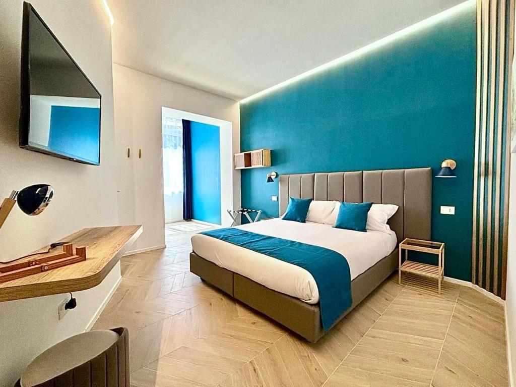 Ένα ή περισσότερα κρεβάτια σε δωμάτιο στο Reno Suite Bologna