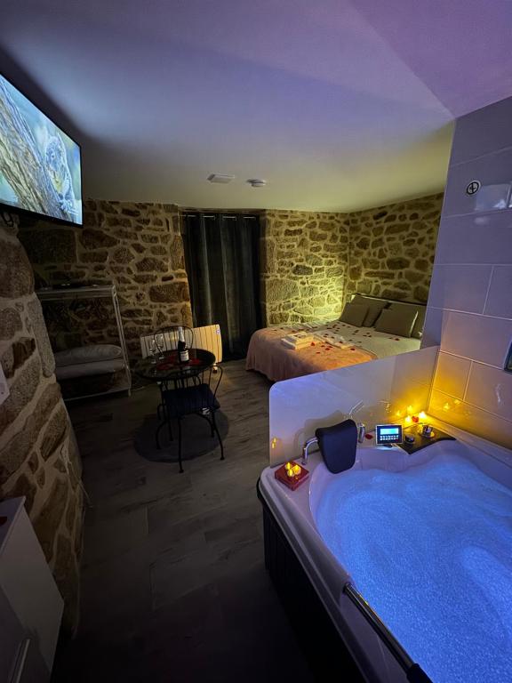 a room with a large blue tub in a room at La casita de los Arribes in Fermoselle