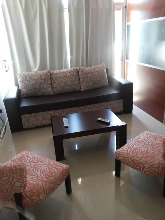 a living room with a couch and a coffee table at San Isidro in Viedma
