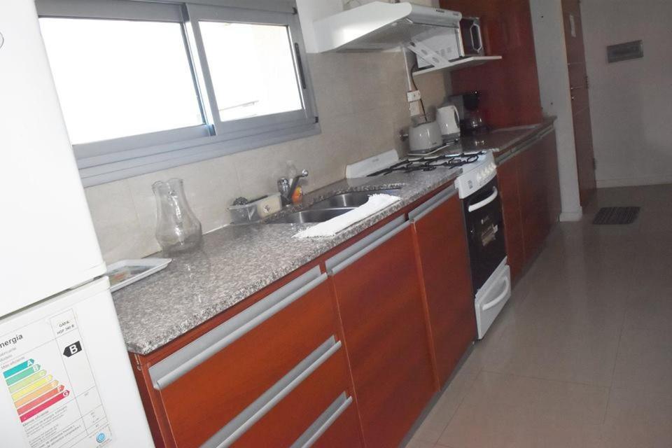 a kitchen with a sink and a stove at San Isidro in Viedma