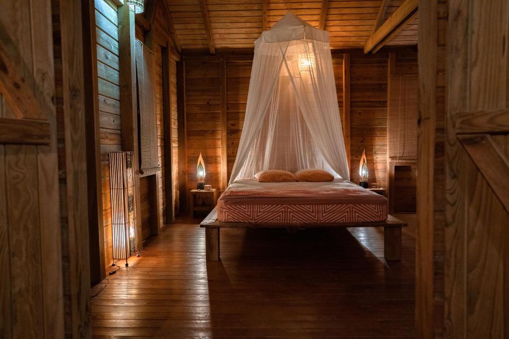 Postel nebo postele na pokoji v ubytování Au Jardin Des Colibris Ecolodge&Spa
