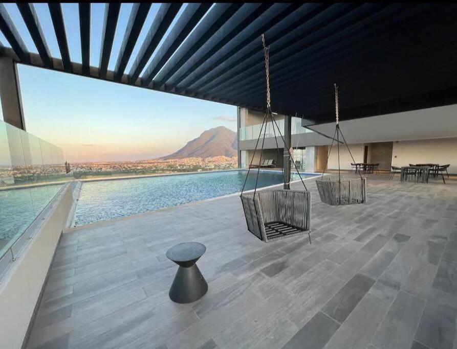 a large building with a view of the water at Lujoso departamento en Monterrey in Monterrey