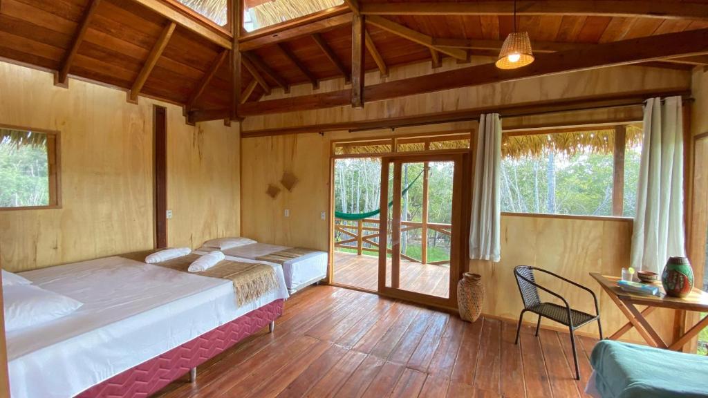 A bed or beds in a room at Bioma EcoLodge