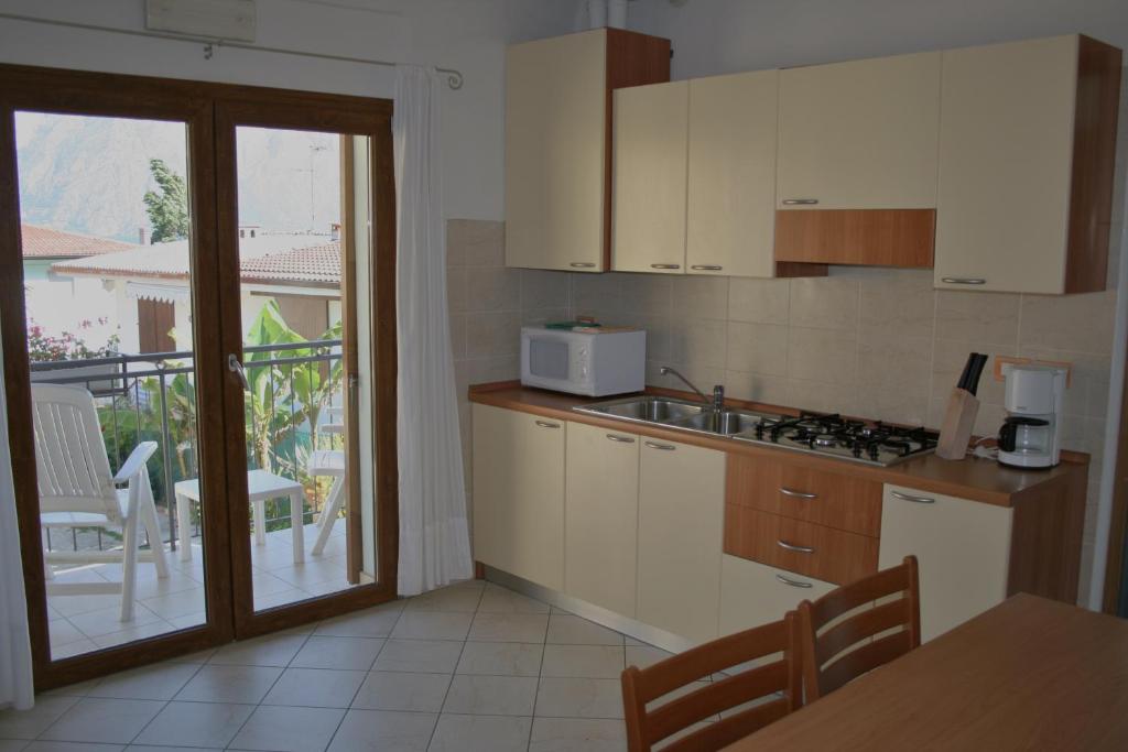 Kuchyň nebo kuchyňský kout v ubytování Albergo San Remo