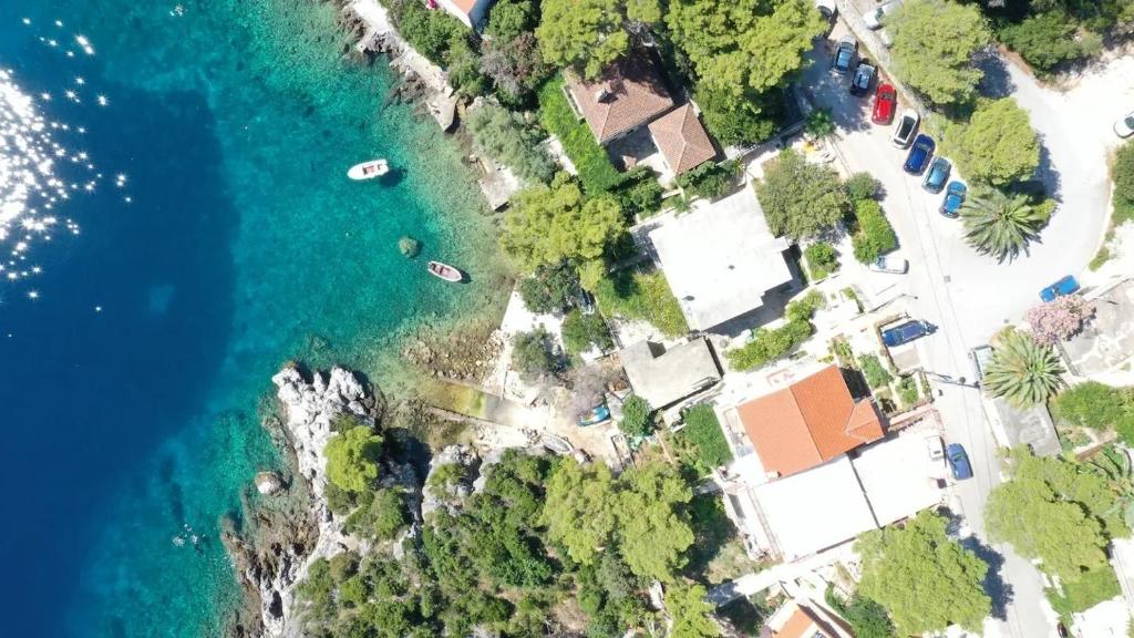an aerial view of a house next to the ocean at Apartments by the sea Sobra, Mljet - 22343 in Babino Polje