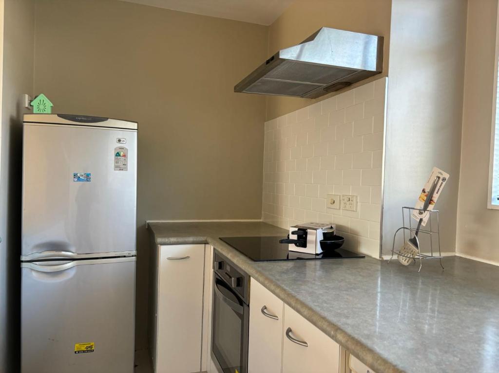 Kuchyň nebo kuchyňský kout v ubytování New Lynn Tidy House