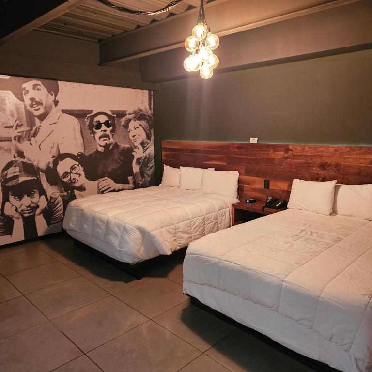 Postel nebo postele na pokoji v ubytování HOTEL RIO RITA