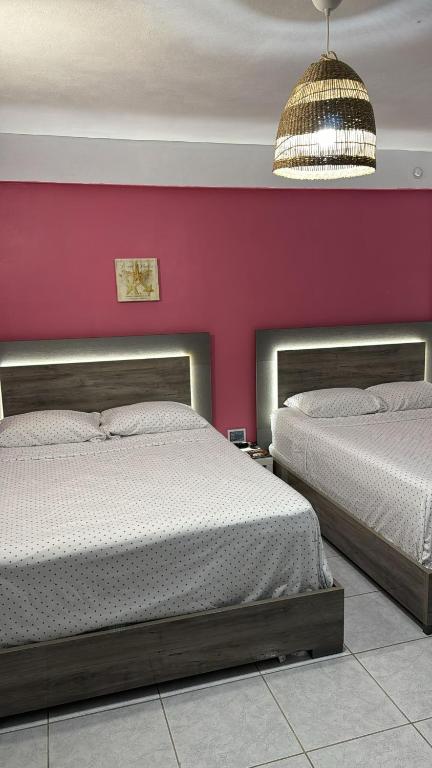 Postel nebo postele na pokoji v ubytování Playa Apartments