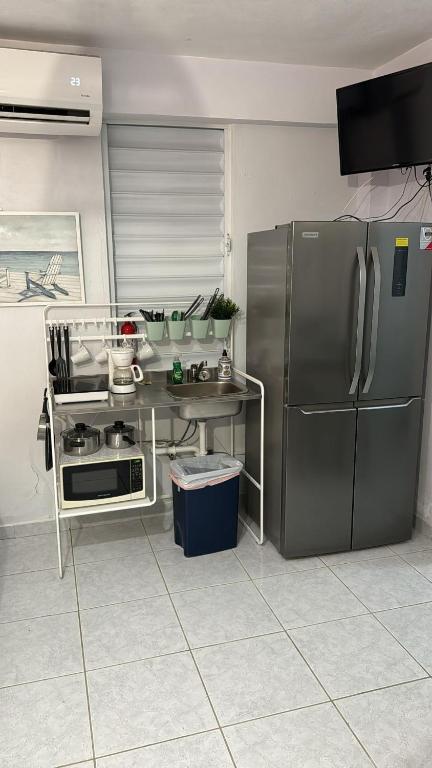 Kuchyň nebo kuchyňský kout v ubytování Playa Apartments
