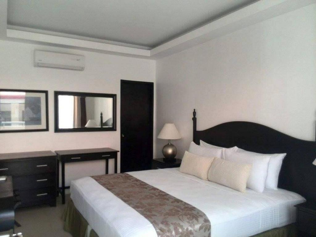 Postel nebo postele na pokoji v ubytování Chateau De Boracay
