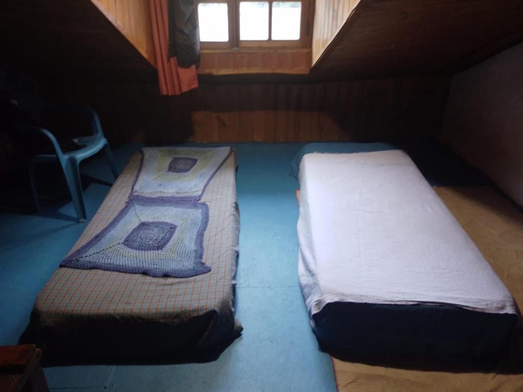 Ένα ή περισσότερα κρεβάτια σε δωμάτιο στο Cabaña las florcitas