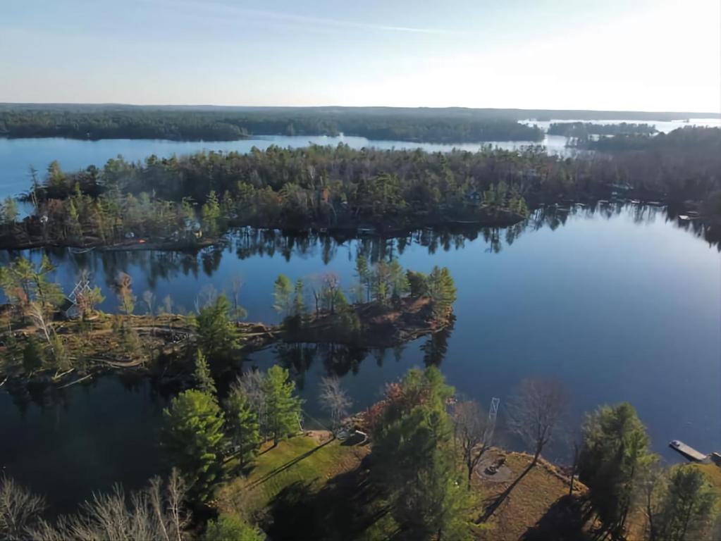 an island in the middle of a lake at On The Rocks A Waterfront Cottage on Stoney Lake in woodview