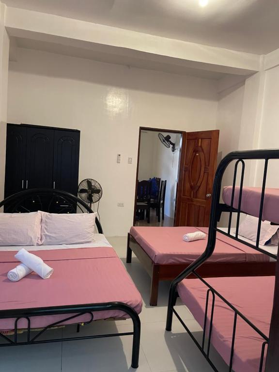 Postel nebo postele na pokoji v ubytování Noguerra Homestay