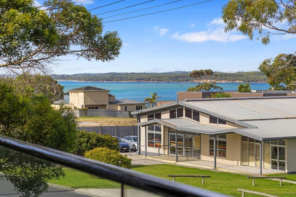 a house with a view of the water at Sail Away Inlet Side in Inverloch