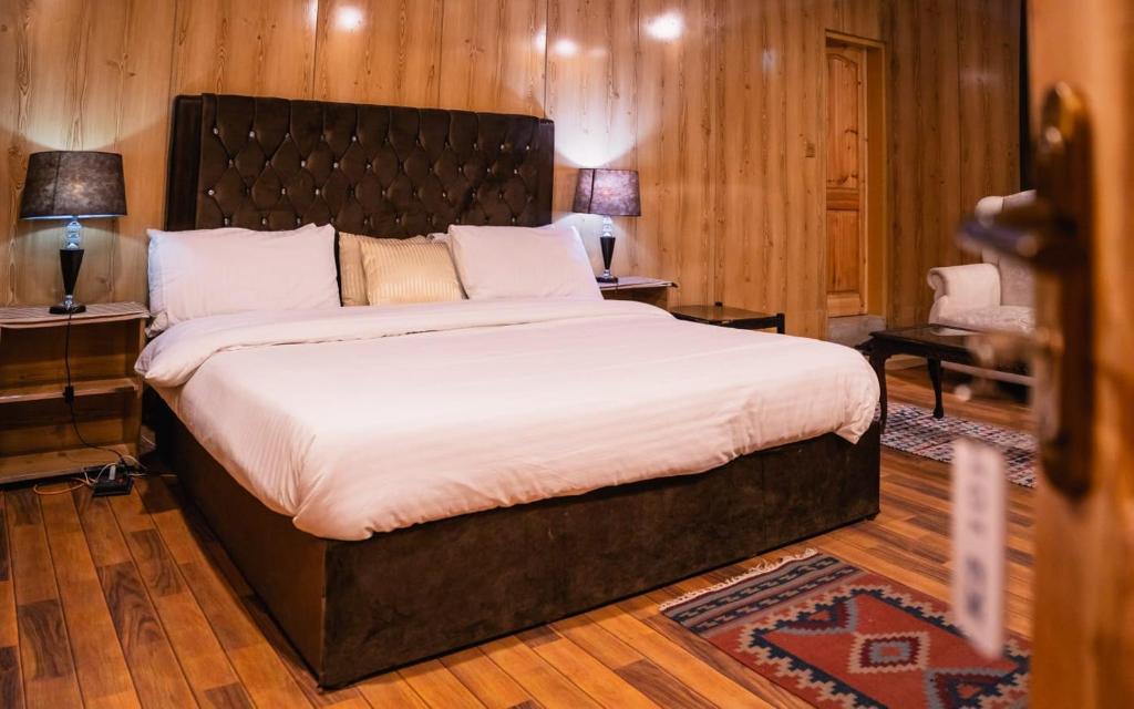 a bedroom with a large bed in a room at K2 Paradise Guest house in Skardu