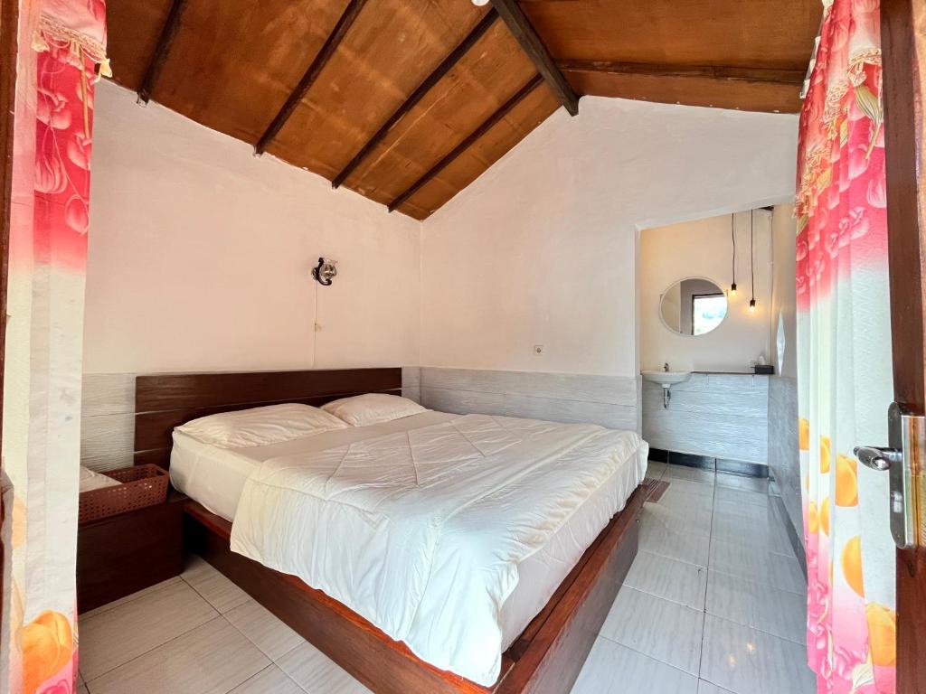 Postel nebo postele na pokoji v ubytování Sembalun Kita Cottage
