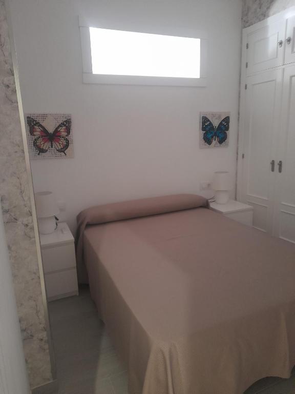 Postel nebo postele na pokoji v ubytování Hostal Casandra - antiguo Hostal Los Valencianos