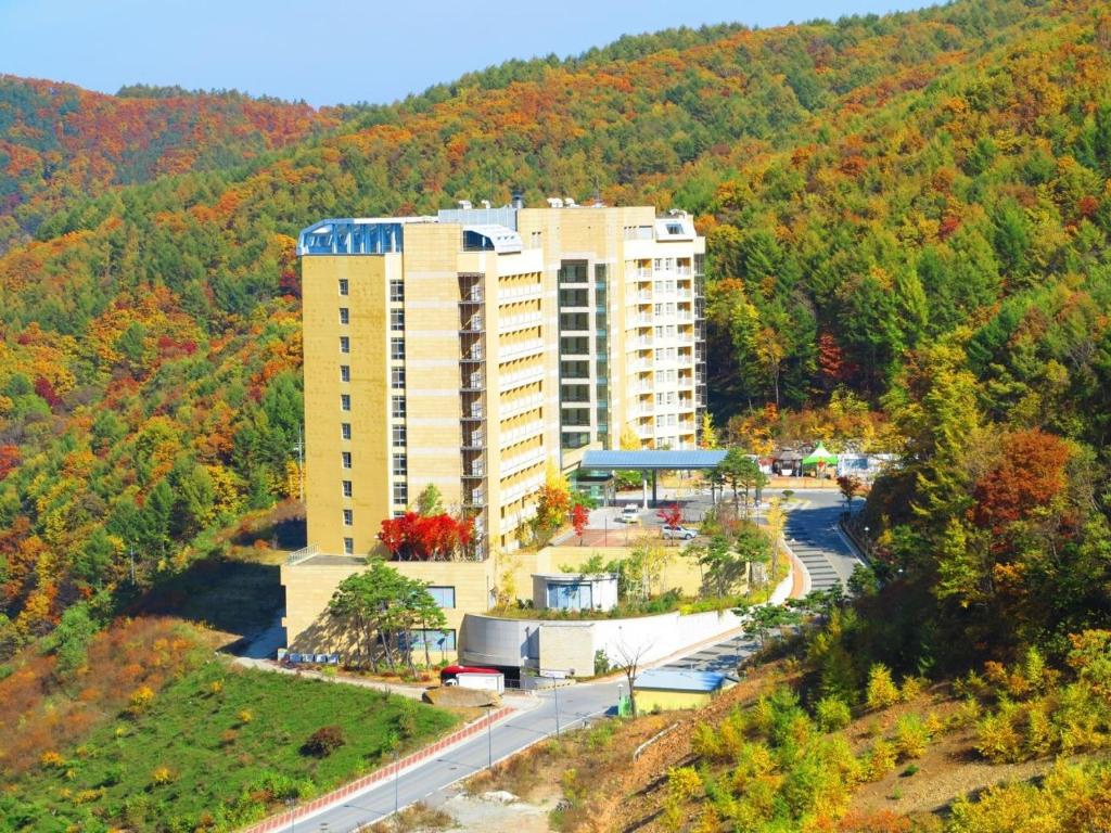 an aerial view of a building on a hill at High Castle Resort in Jeongseon