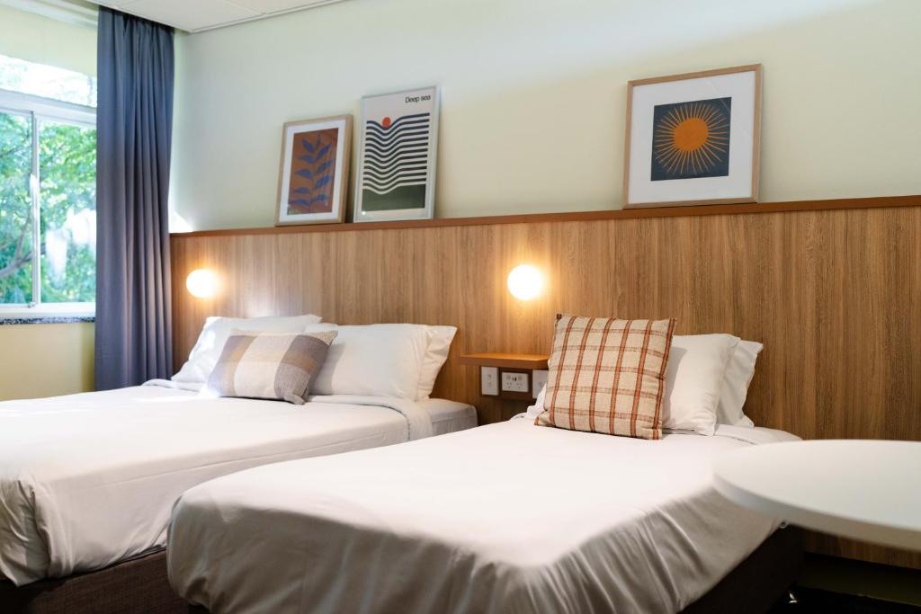 Tempat tidur dalam kamar di Brighton Hotel