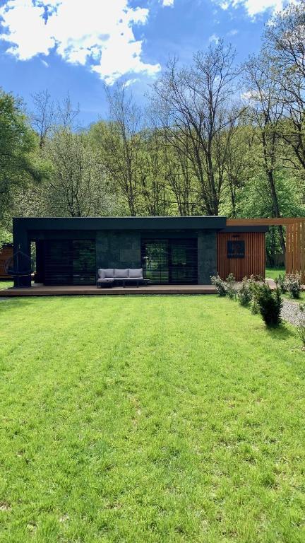 a modern house with a large yard at Forestlux Vendégház in Zebegény