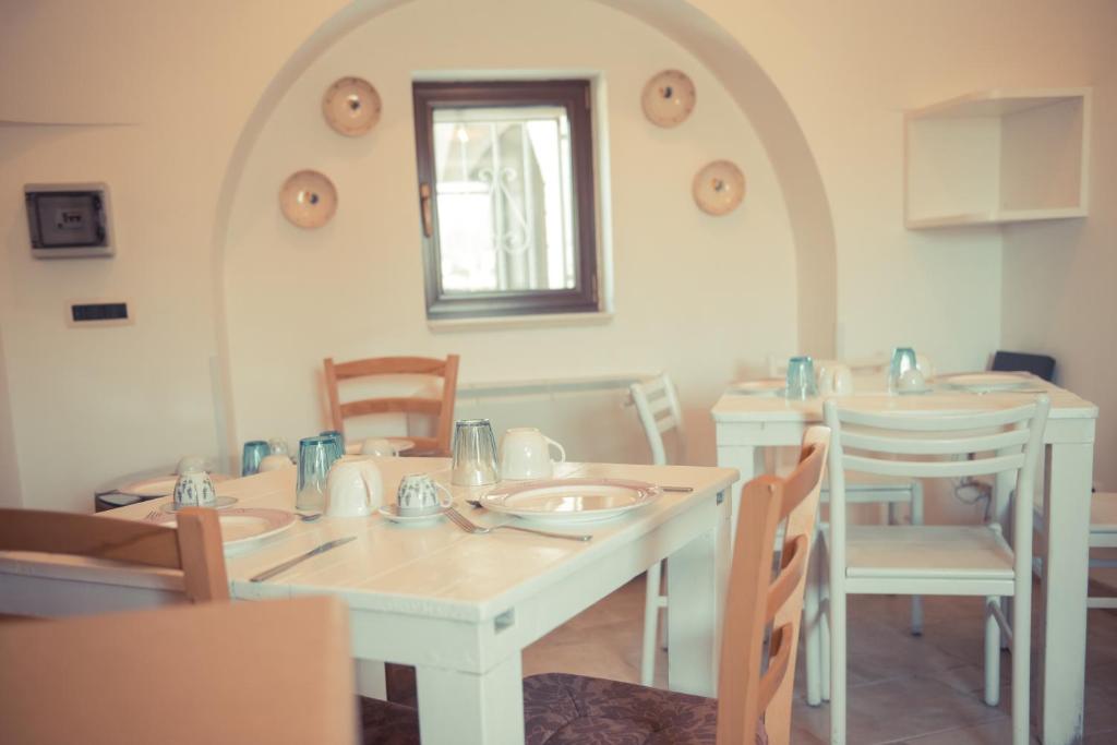 Posezení v ubytování I Trulli Di Badi