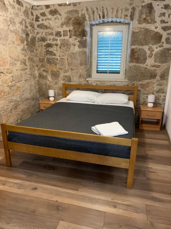 Ένα ή περισσότερα κρεβάτια σε δωμάτιο στο Fig Tree Murter