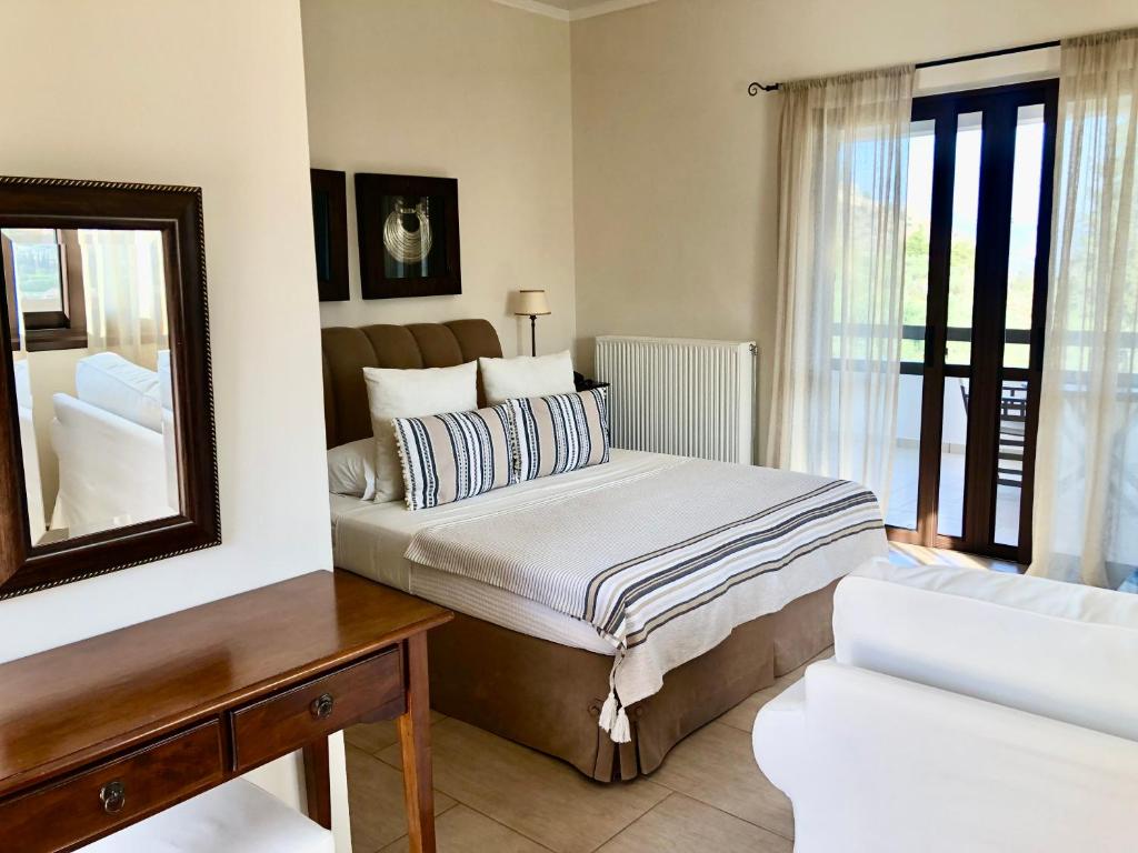 Кровать или кровати в номере Elaion mini suites