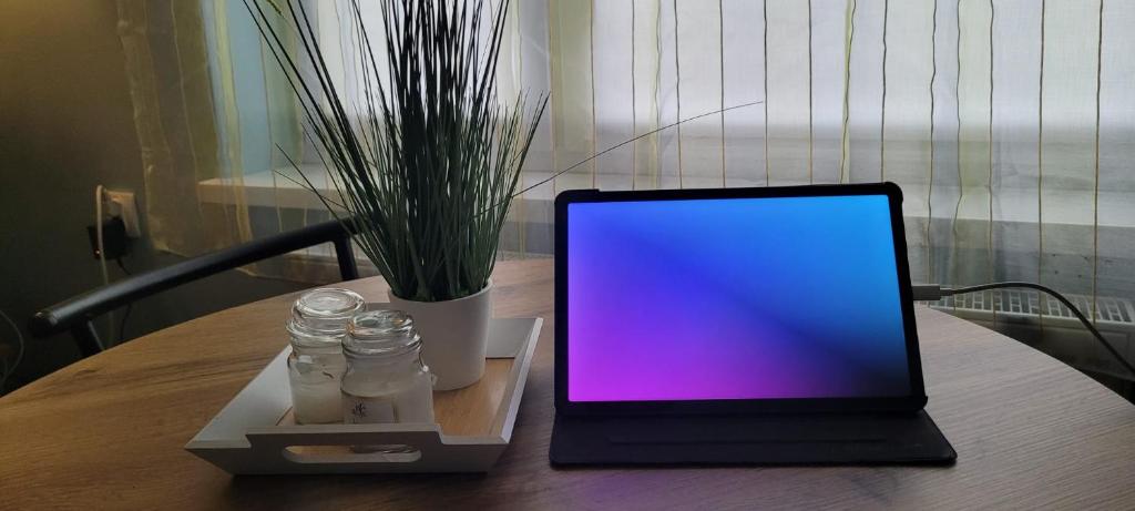 a laptop computer sitting on top of a table at Spokojne i miłe miejsce na Mazurach in Kętrzyn