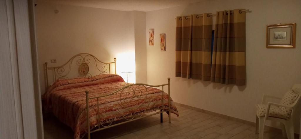 Un pat sau paturi într-o cameră la Olivo Bonsai
