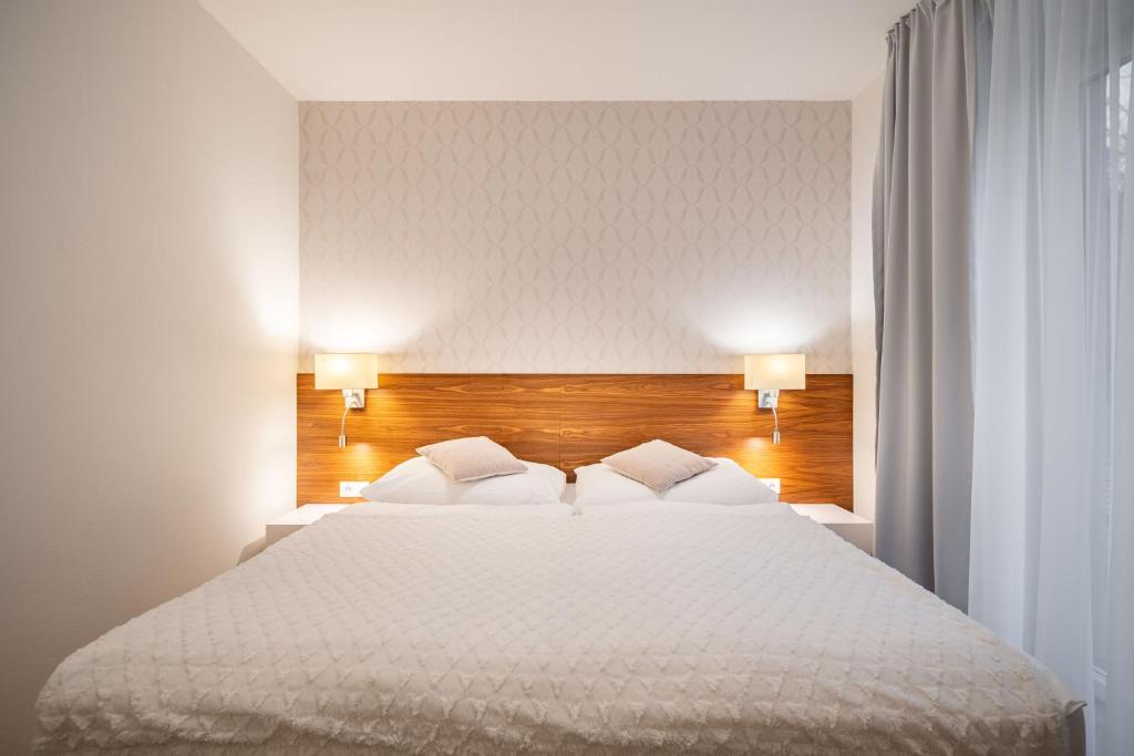 Postel nebo postele na pokoji v ubytování Vila EVA