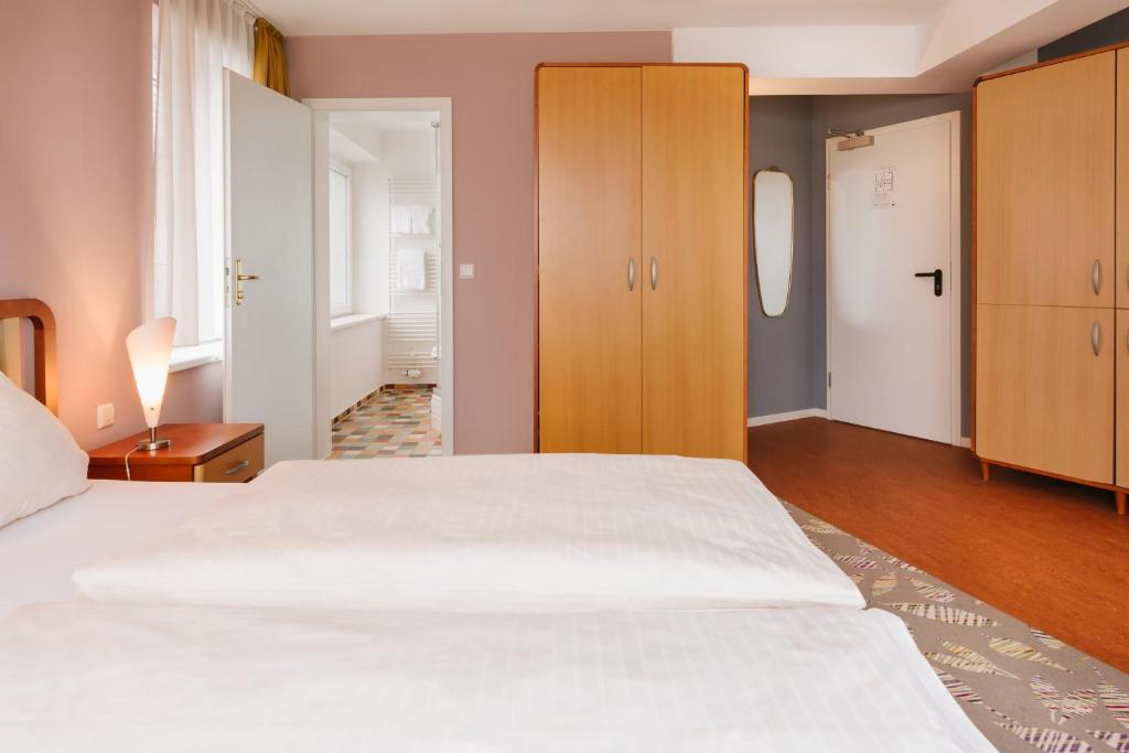 Postel nebo postele na pokoji v ubytování Klassik Appartements