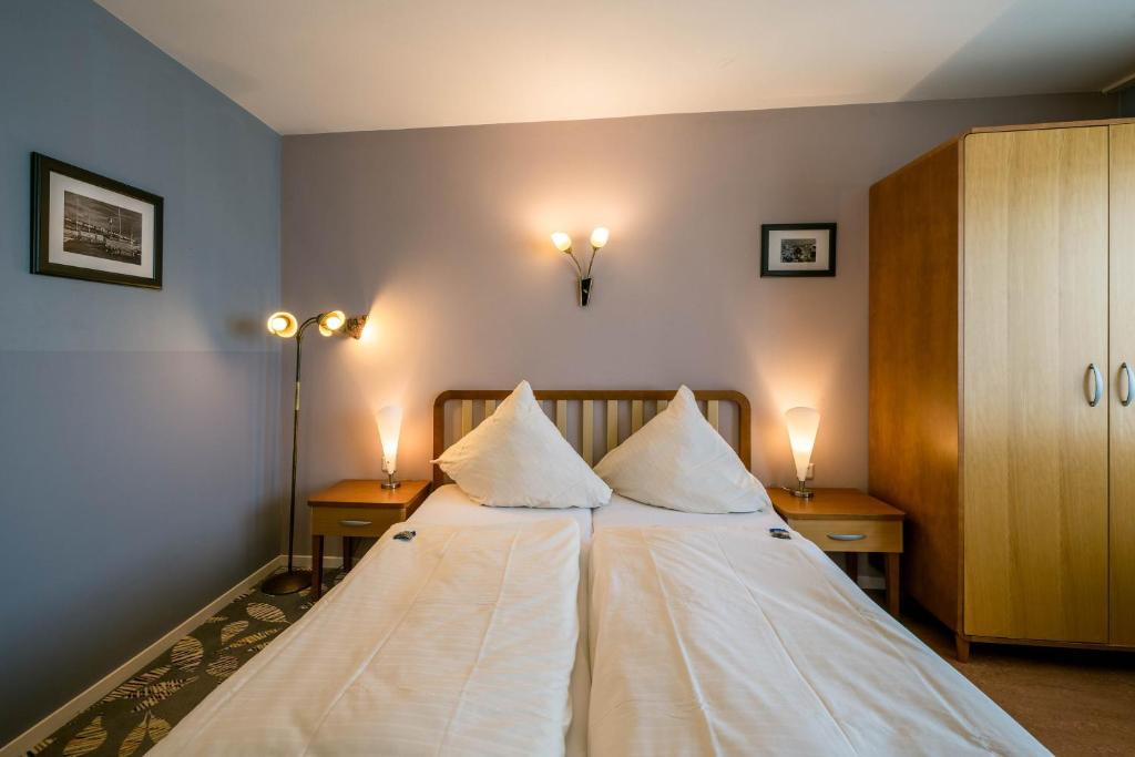 Postel nebo postele na pokoji v ubytování Klassik Appartements