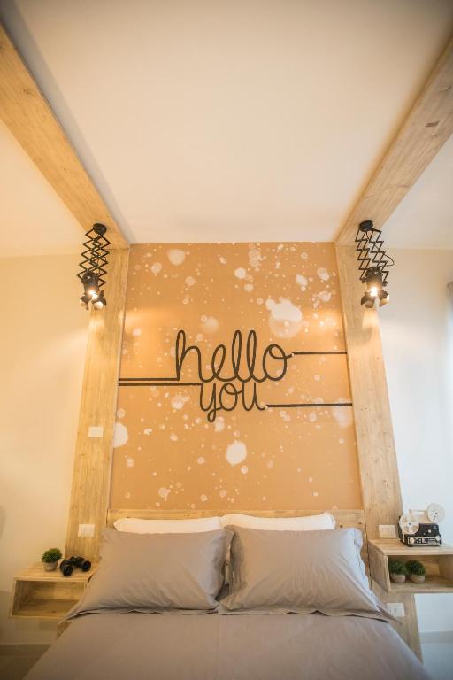 Postel nebo postele na pokoji v ubytování Albergo Diffuso Dimora Rossi Suite B&B