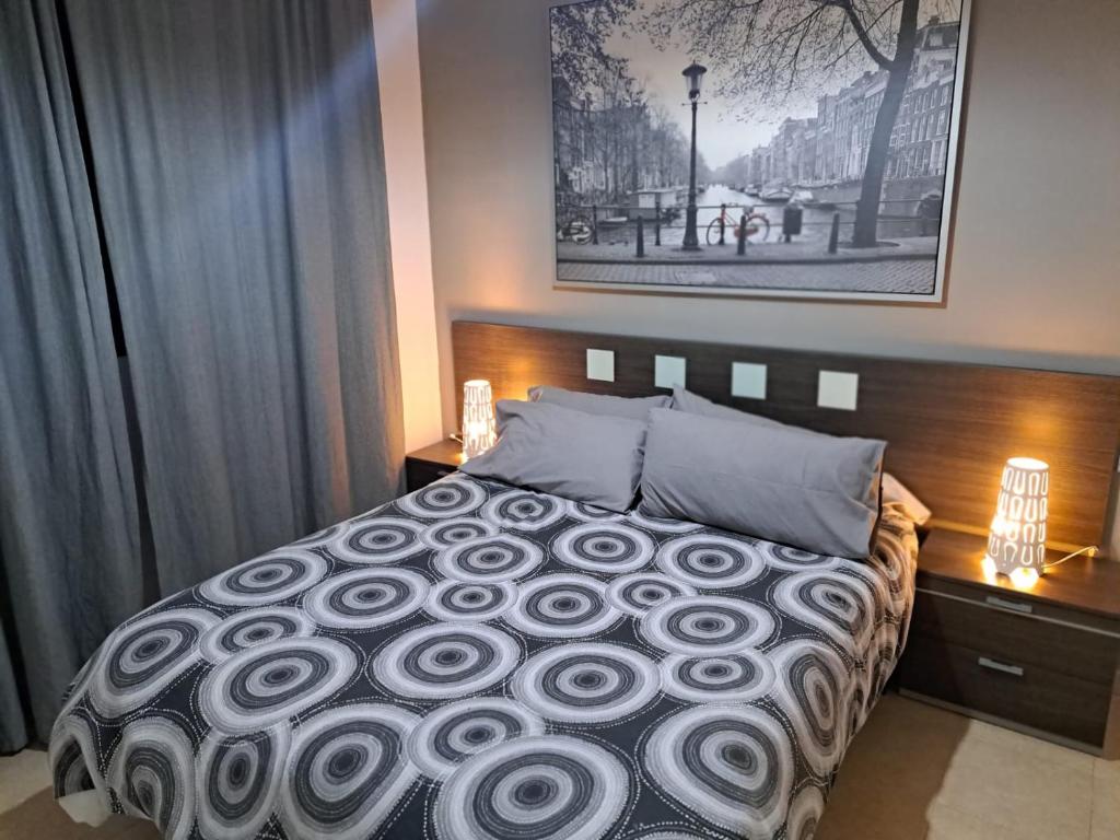 Łóżko lub łóżka w pokoju w obiekcie Apartamento Eursu Playa