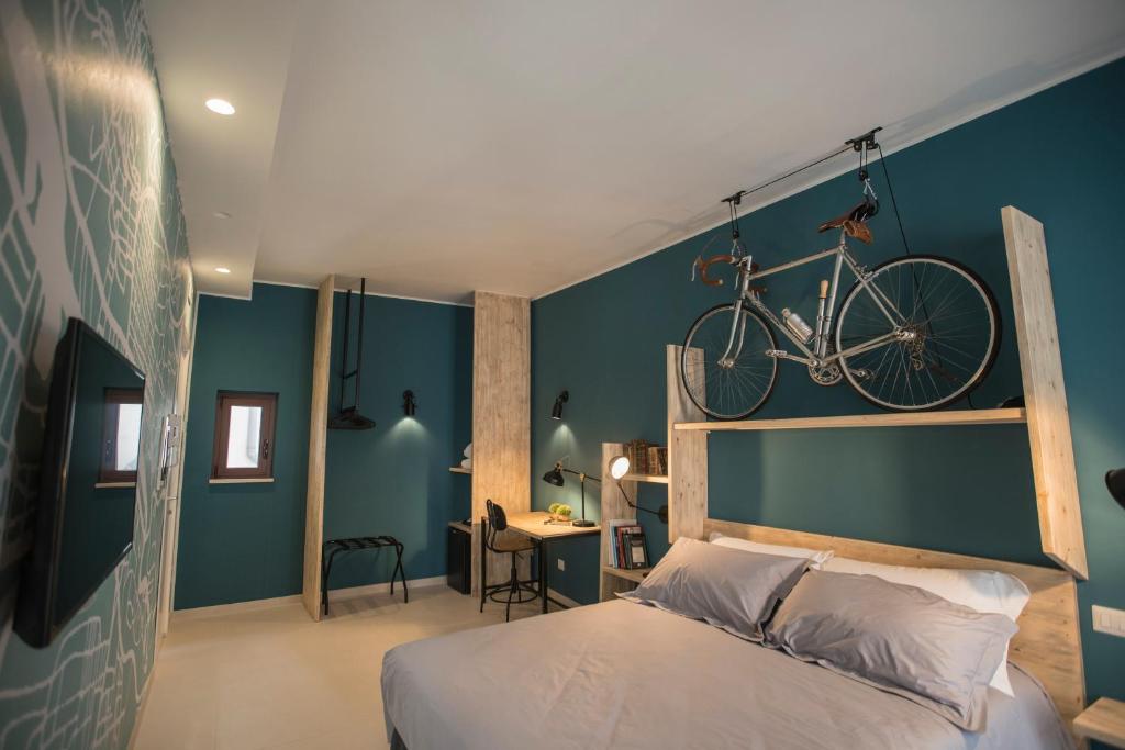 TV a/nebo společenská místnost v ubytování Albergo Diffuso Dimora Rossi Suite B&B