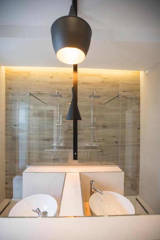 Postel nebo postele na pokoji v ubytování Albergo Diffuso Dimora Rossi Suite B&B