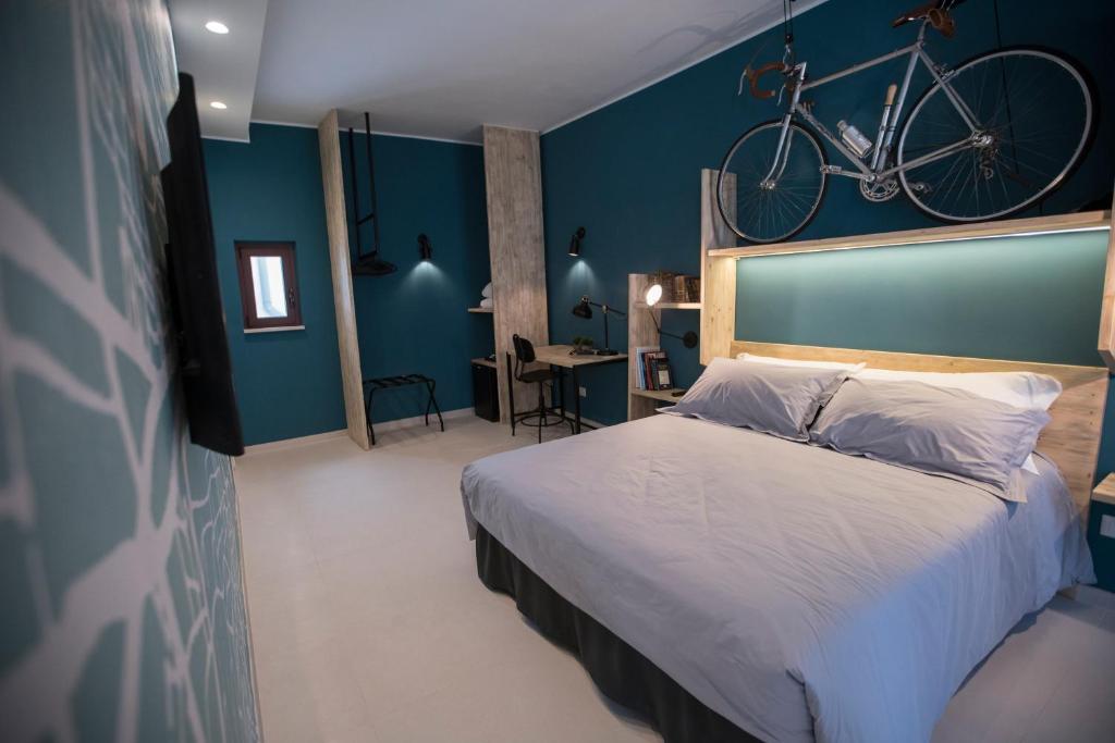 Postel nebo postele na pokoji v ubytování Albergo Diffuso Dimora Rossi Suite B&B