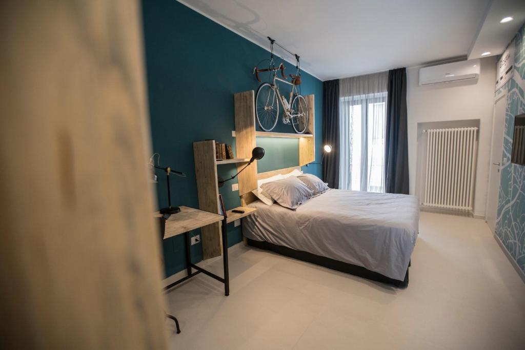 Postel nebo postele na pokoji v ubytování Albergo Diffuso Dimora Rossi Suite B&B