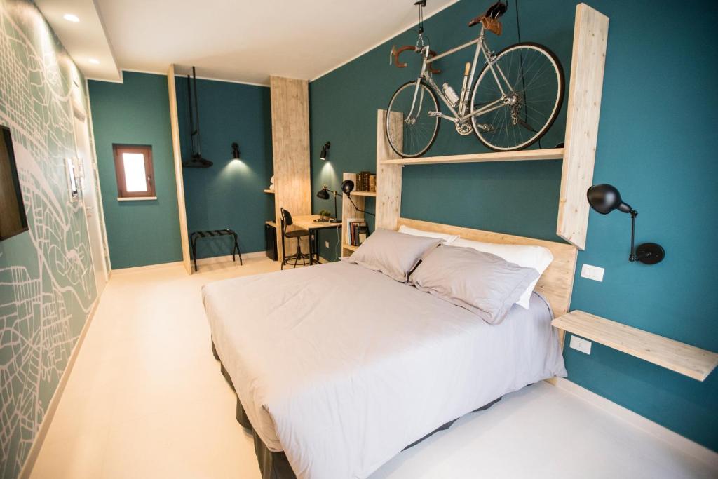 Postel nebo postele na pokoji v ubytování Albergo Diffuso Dimora Rossi Suite B&B
