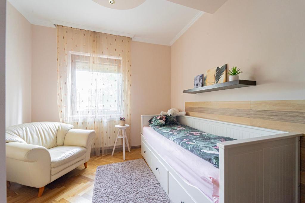 Postel nebo postele na pokoji v ubytování B48 Bigflat - kényelem 130 m2 en