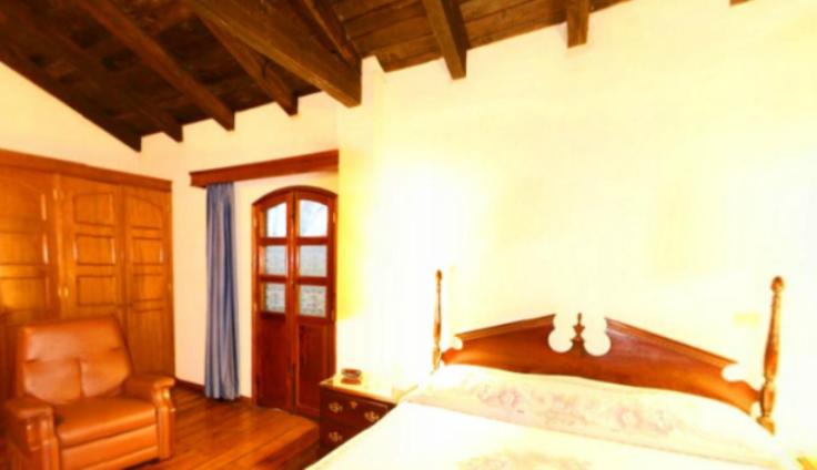 Postel nebo postele na pokoji v ubytování Posada Coatepec