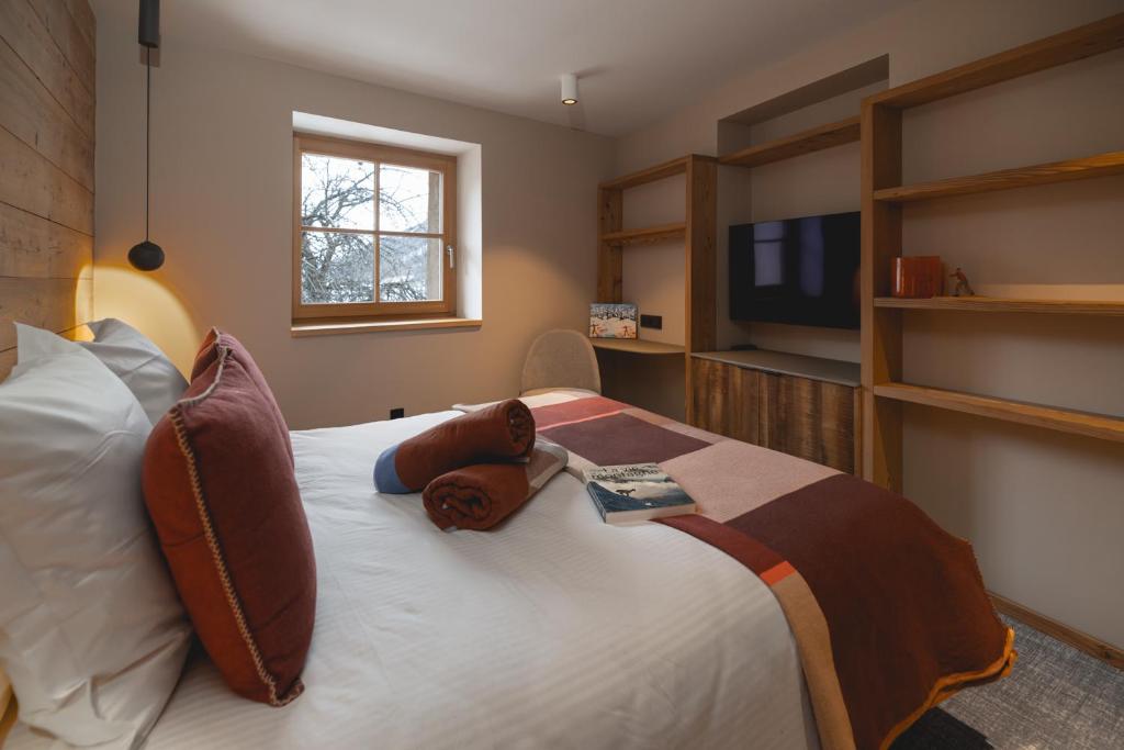 Postel nebo postele na pokoji v ubytování Alliey & Spa Piscine Appart-hôtel Serre chevalier