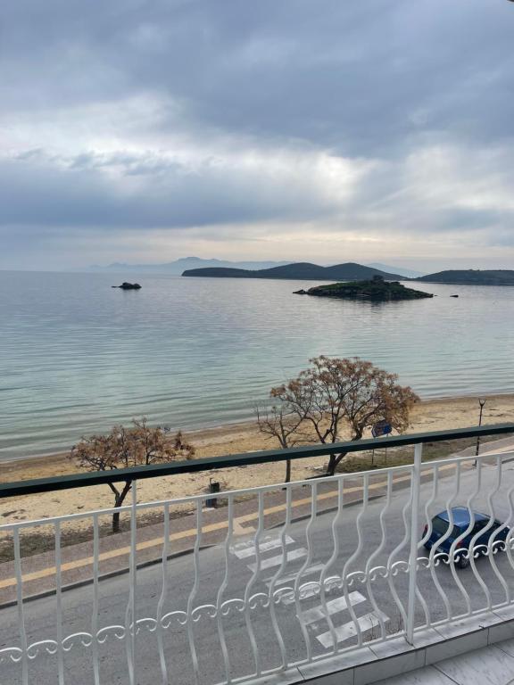 a view of the ocean from a balcony at Sunlight apartment in Nea Peramos
