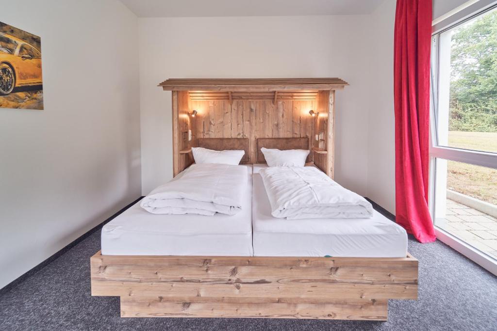 Postel nebo postele na pokoji v ubytování Hotel am Interpark
