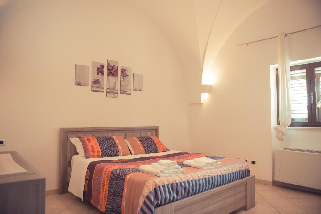 Postel nebo postele na pokoji v ubytování I Trulli Di Badi
