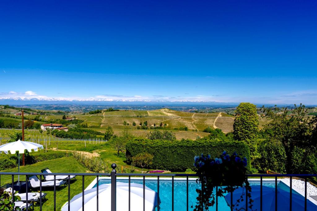 a view from the balcony of a villa with a swimming pool at Borgo Piani - Camere di Charme in Mango