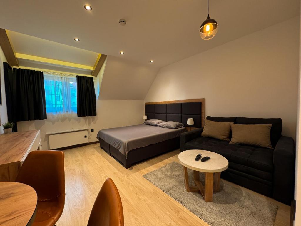 Postel nebo postele na pokoji v ubytování Vip Apartments Kopaonik